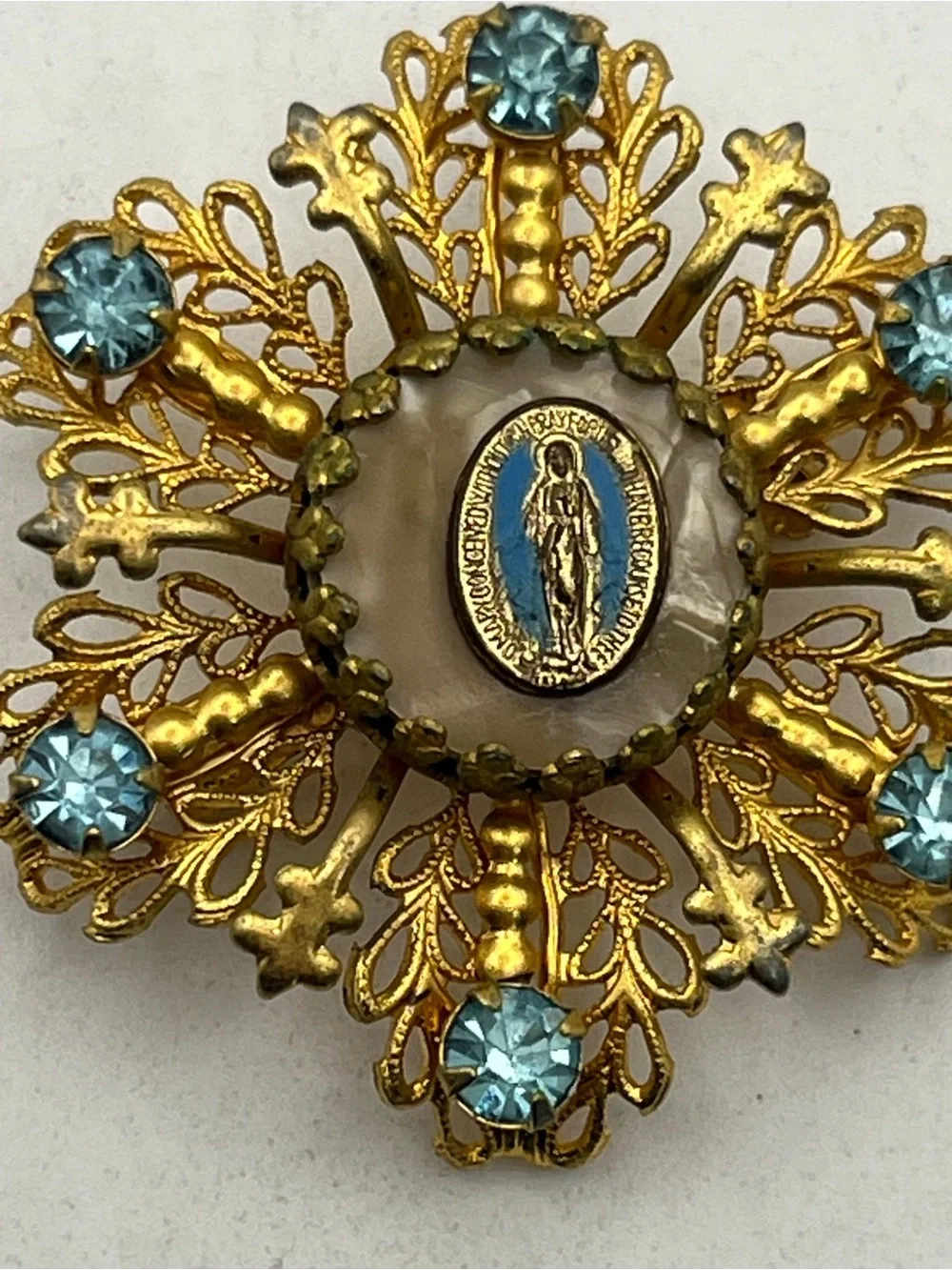 Miraculous medal Catholic Virgin Mary blue rhinestone gold tone starburst brooch